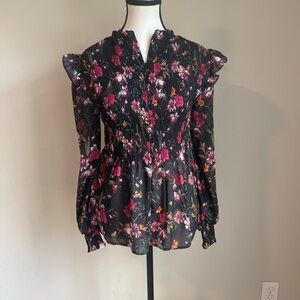 NWT Beautiful floral blouse with ruffled sleeves and zipper in the front